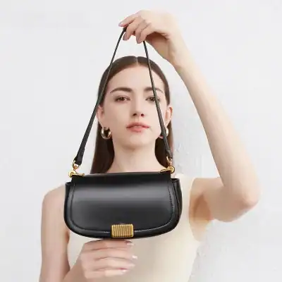 Luxurious black handbag with gold accents, perfect for stylish accessorizing. Elevate your fashion statement with this elegant bag from Monalisa Store.