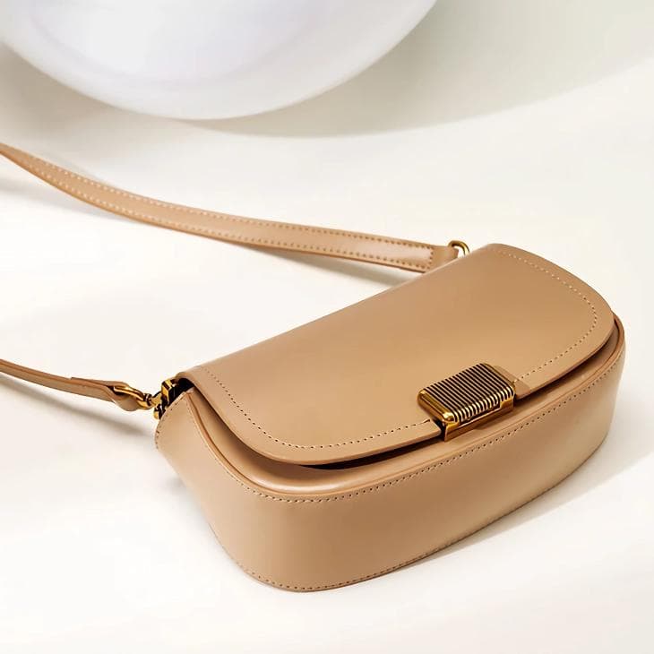 Luxury beige women's handbag made of premium material, ideal for fashion-forward individuals, with a sophisticated look for various occasions.