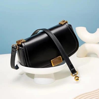 Luxury black leather handbag with gold accents, ideal for fashionable women seeking sophisticated accessories. Perfect for daily use or special occasions.