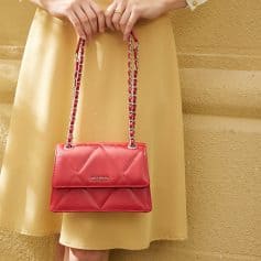 Stylish red quilted handbag with chain strap for women, perfect for fashion and accessories.