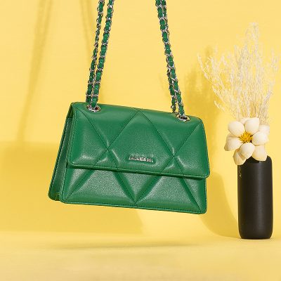 Stylish green leather handbag with chain strap, perfect for fashion-forward women seeking luxury accessories.