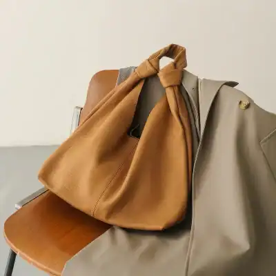 High-quality brown handbag with elegant design, perfect for daily use and fashion accessories. Durable material ideal for women seeking trendy and functional bags.