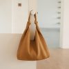 Stylish tan leather tote bag, perfect for daily use and fashion accessories at Monalisa Store. High-quality craftsmanship, versatile and timeless design for women.
