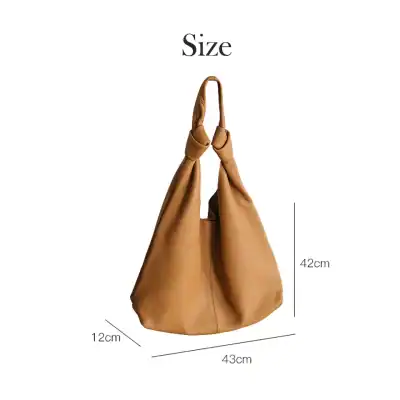 Stylish brown handbag with adjustable handle, perfect for everyday use, measuring 43cm x 12cm x 42cm for spacious convenience.