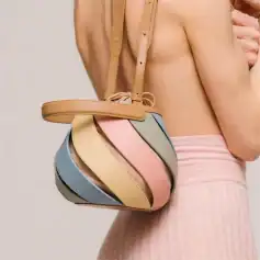 Elegant multi-colored leather shoulder bag with a unique twisted design, perfect for fashion-forward individuals seeking stylish accessories.