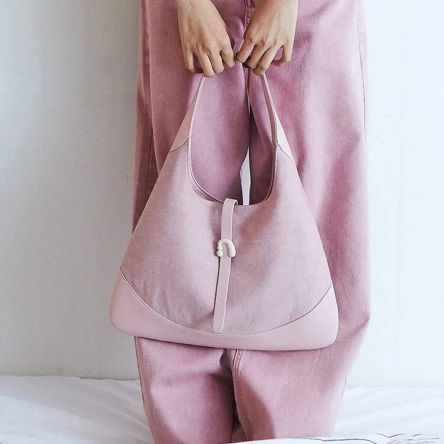 Elegant pink tote bag with sleek design, ideal for daily errands or work, crafted with high-quality materials for durability and style.