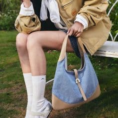 Stylish tote bag with a combination of fabric and leather, perfect for shopping or casual outings, available at Monalisa Store.