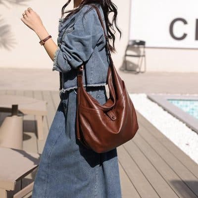 Striking brown leather handbag for women, perfect for daily use and fashion-forward outfits. Durable, stylish, and spacious, ideal for shopping, work, or casual outings.
