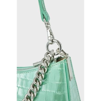 Stylish mint green patent leather handbag with silver chain strap and hardware, perfect for trendy outfits and fashionable accessories for women.