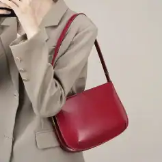 Elegant red leather handbag for women, perfect for everyday use and fashion statements. Crafted with high-quality material, it adds a touch of sophistication to any outfit.