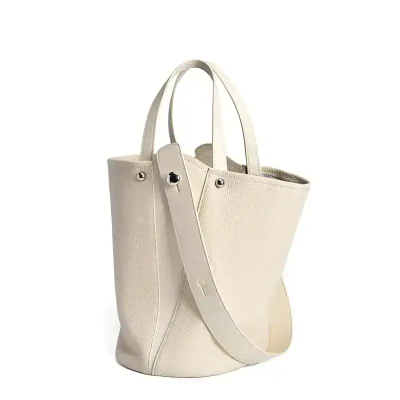 Stylish and spacious white tote bag perfect for daily use, shopping, or work, offering a sophisticated accessory choice for fashion-forward women.