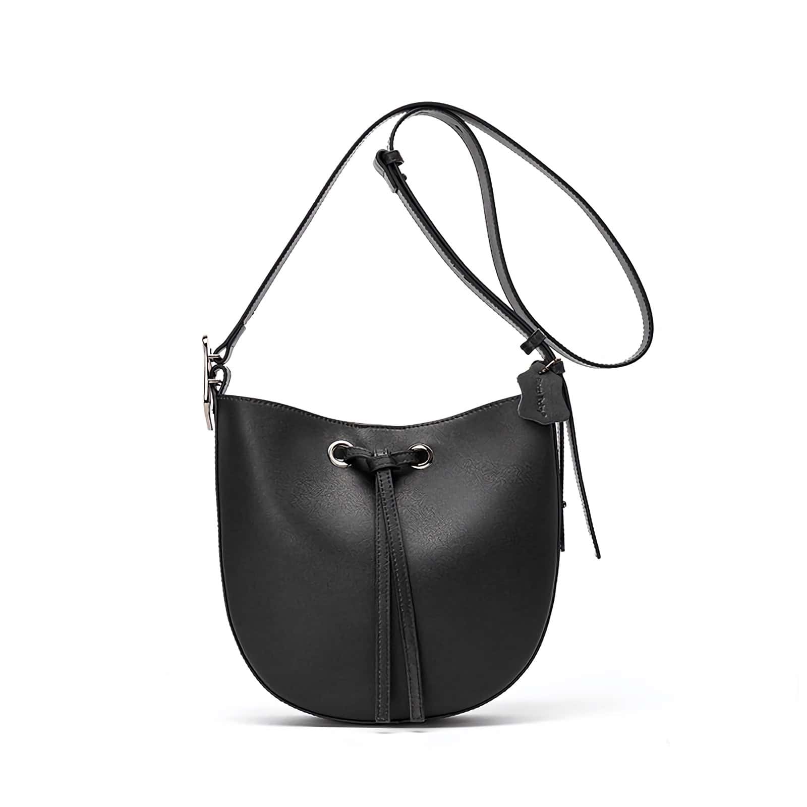 Stylish black leather shoulder bag, perfect for everyday use or special occasions, featuring adjustable strap and zippered compartments for convenience.