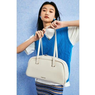 Stylish white designer handbag for women, perfect for fashion accessories and daily use. Features sleek design and durable materials for versatile styling.