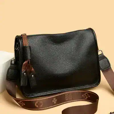 Stylish black leather bag for women with adjustable strap, perfect for everyday use and fashion-forward Looks.