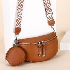 Elegant brown leather handbag with adjustable patterned shoulder strap, perfect for women’s fashion accessories and everyday use.