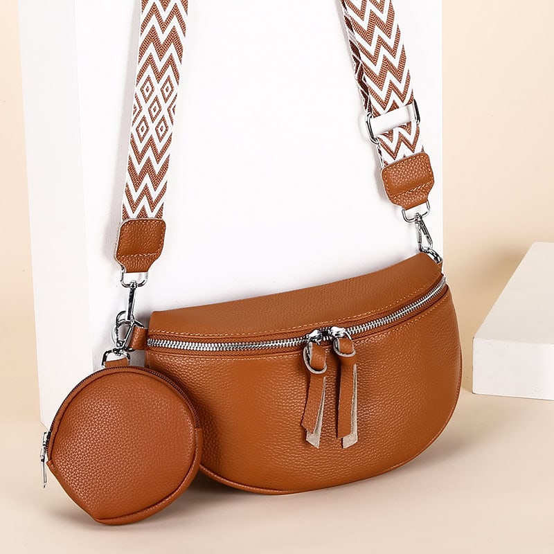 Elegant brown leather handbag with adjustable patterned shoulder strap, perfect for women’s fashion accessories and everyday use.