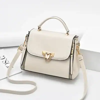 Luxury white leather handbag with gold hardware, chain details, and adjustable strap for women. Perfect for stylish outings and everyday use.