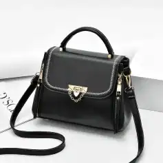 Elegant black fashion handbag featuring gold hardware and chain detail, perfect for stylish accessories and daily use.