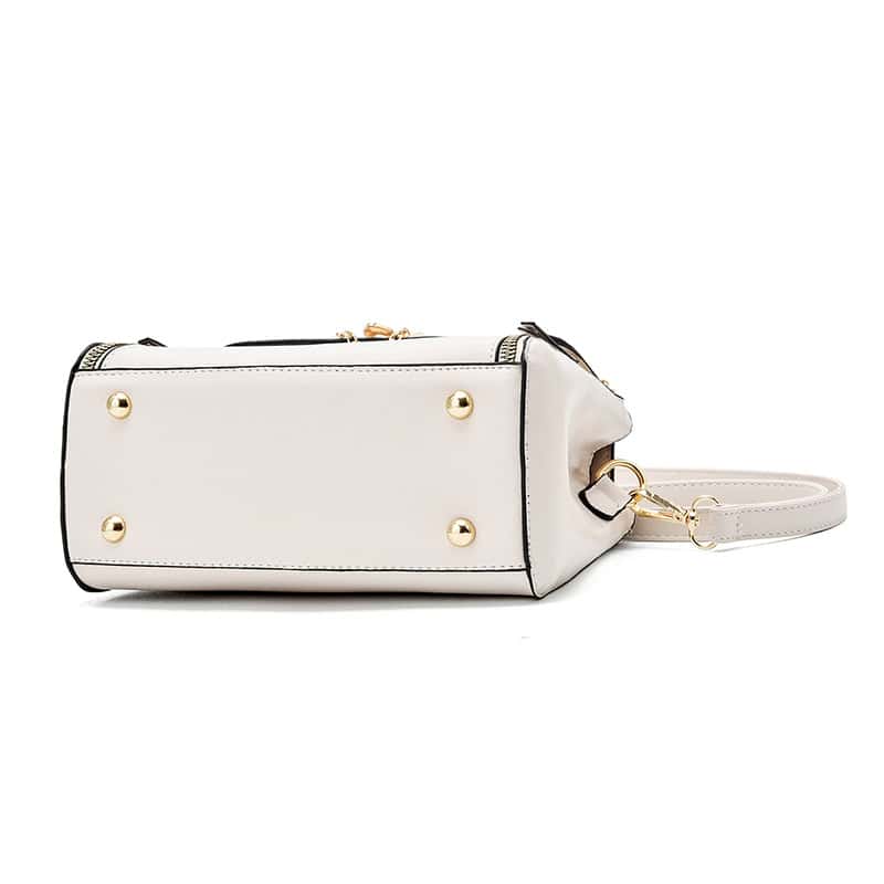 Stylish white leather handbag with gold accents, perfect for fashion-forward accessories.
