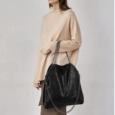 Stylish black leather tote with chain details, perfect for fashion-forward women. Ideal for daily use, office, or casual outings.