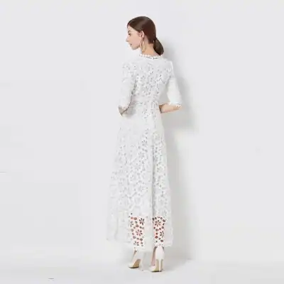 High-quality white lace dress featuring floral cutouts, perfect for formal occasions and elegant nights out. Designed for a sophisticated and slimming silhouette with comfortable fit.