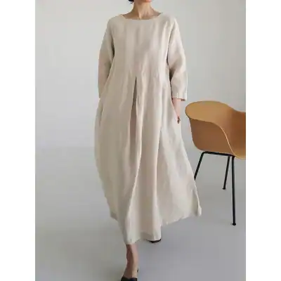 Light beige linen dress with a relaxed fit, long sleeves, and a flowing silhouette, perfect for casual or semi-formal occasions. Comfortable, breathable, and stylish.