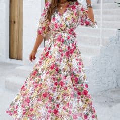 Elegant floral summer maxi dress perfect for warm weather and vacation. Features vibrant pink, yellow, and green floral print, flowy fit, and stylish neckline. Ideal for beach outings, casual wear, or garden parties.