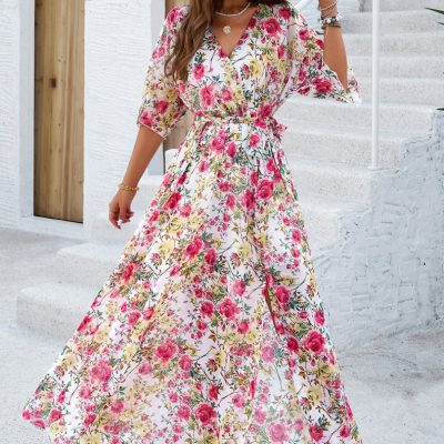 Elegant floral summer maxi dress perfect for warm weather and vacation. Features vibrant pink, yellow, and green floral print, flowy fit, and stylish neckline. Ideal for beach outings, casual wear, or garden parties.