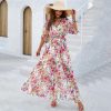 Stylish floral maxi dress with vibrant pink and green patterns, perfect for summer and vacation wear. Made from lightweight, breathable fabric, offering comfort and style for all occasions.