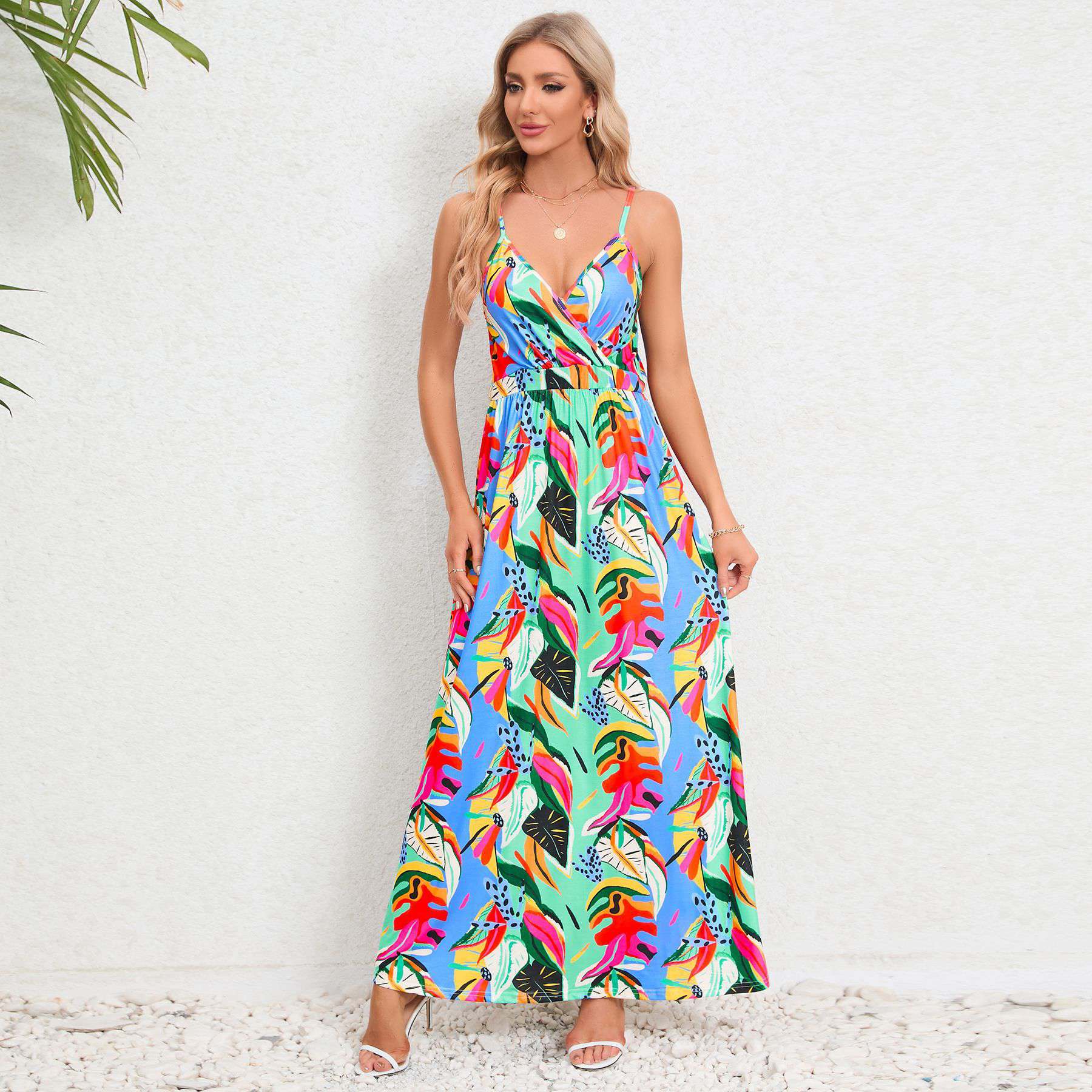 Colorful tropical print maxi dress with adjustable straps and flowy silhouette, perfect for vacation or casual outings.
