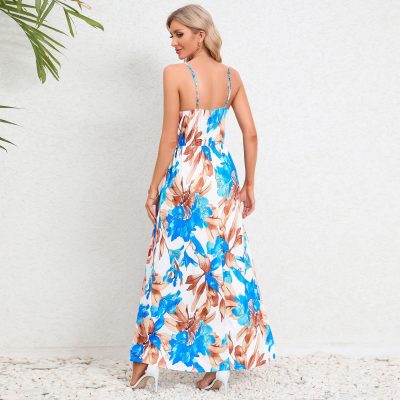 Floral maxi dress in vibrant blue and brown, featuring spaghetti straps, ideal for summer outings and beach vacations. Available at Monalisa Store for fashionable women.
