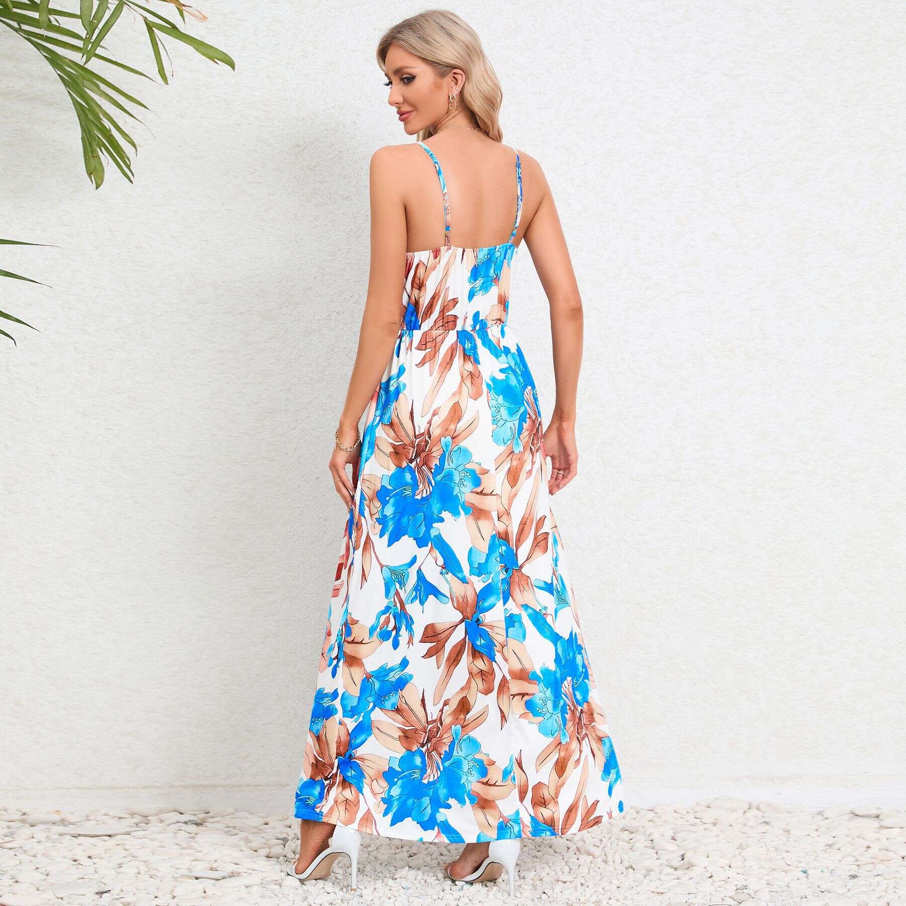 Floral maxi dress in vibrant blue and brown, featuring spaghetti straps, ideal for summer outings and beach vacations. Available at Monalisa Store for fashionable women.