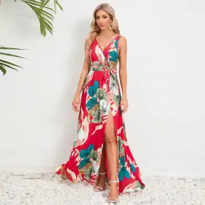 Elegant women's tropical maxi dress with vibrant floral print, deep V-neck, high slit, and adjustable waist tie, perfect for summer and beachwear.