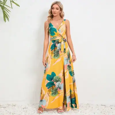 A stylish, colorful maxi dress with a tropical leaf pattern, perfect for summer outings and vacations, available at Monalisa Store.