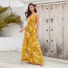 Bright yellow tropical print maxi dress with floral accents, perfect for summer and beachwear. Elegant, lightweight, and comfortable, ideal for casual outings and vacations.