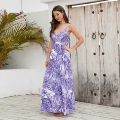 Women’s elegant purple maxi dress with tropical leaf pattern, sleeveless design, and flowy fit for summer, beach, or casual style. Perfect for vacations and outdoor events.