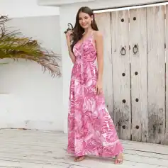 Elegant pink tropical print maxi dress perfect for warm weather, resort wear, or casual outings. Features a flowy silhouette, adjustable straps, and trendy floral pattern.