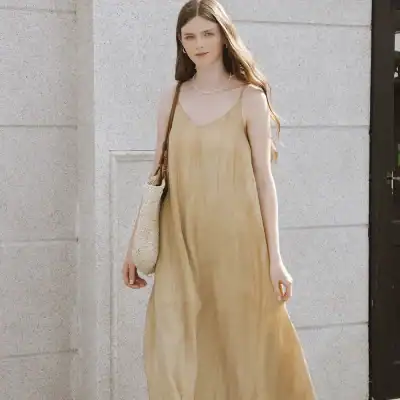 High-quality beige stylish summer dress perfect for casual or beachwear, featuring lightweight fabric, sleeveless design, and comfortable fit. Ideal for enhancing your fashion statement.