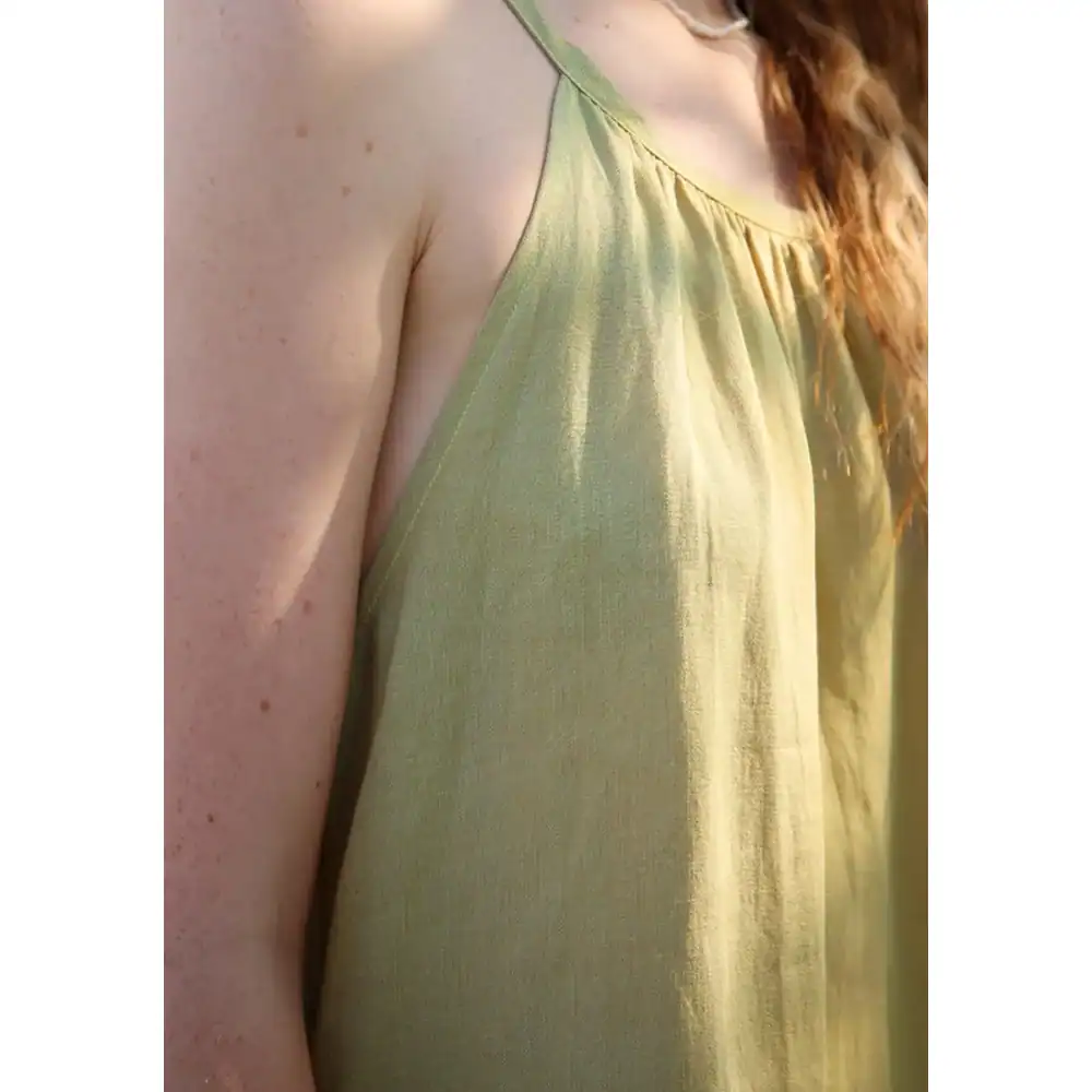 Close-up of a stylish green opt for women, showcasing high-quality fabric and fashionable design from Monalisa Store. Perfect for enhancing your fashion statement.