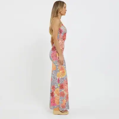 Vibrant floral maxi dress featuring animal print details, ideal for stylish summer outings and events, designed for comfort and elegance.