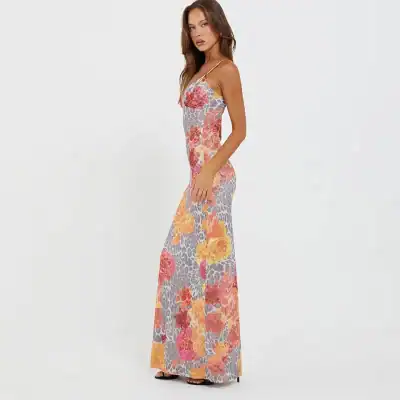 Women’s floral maxi dress with bright colors, thin straps, and a fitted silhouette, perfect for summer events and casual outings.