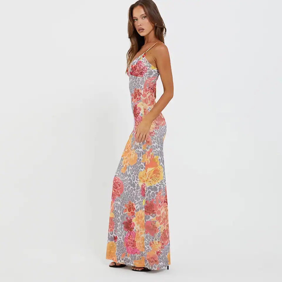 Women’s floral maxi dress with bright colors, thin straps, and a fitted silhouette, perfect for summer events and casual outings.