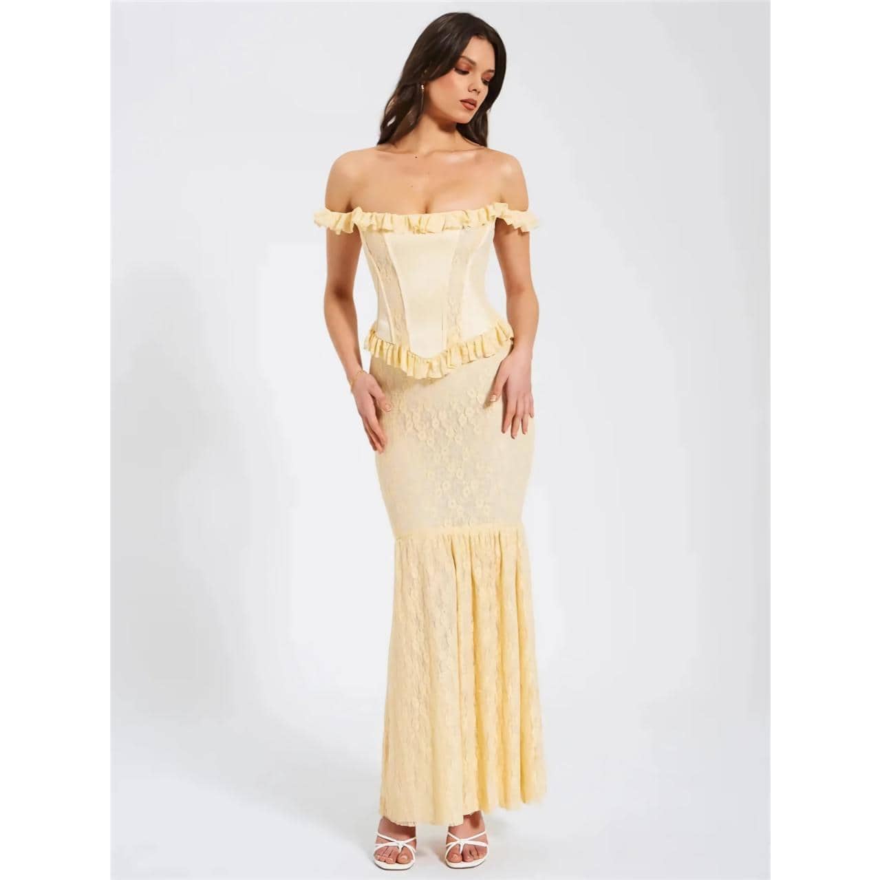 Versatile ivory off-shoulder dress with ruffle accents, lace fabric, and a fitted silhouette, perfect for formal occasions, weddings, or stylish events.