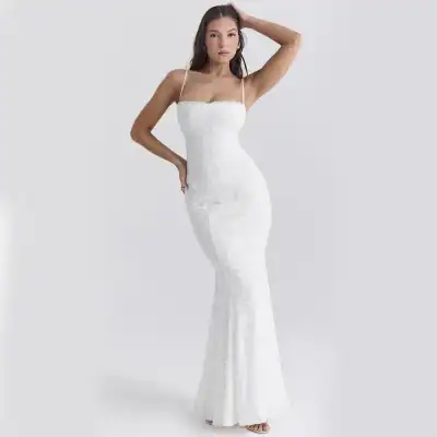 A stunning white wedding gown with delicate lace details, fitted bodice, and flowing mermaid silhouette, perfect for bridal occasion and accessorized with minimal jewelry.