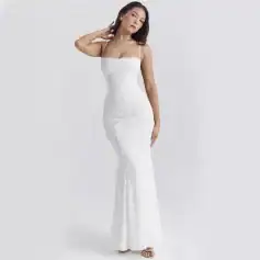 Beautiful white lace wedding dress with spaghetti straps and fitted silhouette, perfect for brides seeking stylish and comfortable wedding attire.