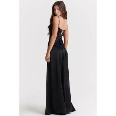 A stunning black evening maxi dress with a stylish lace-up back detail, perfect for formal occasions or special events. Designed for elegance and comfort, ideal for women seeking fashionable maternity or evening wear.