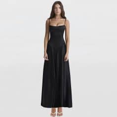 Fashionable black maxi dress with thin spaghetti straps, perfect for formal occasions, evening events, or stylish outings. Made with high-quality fabric for a sleek and modern look.