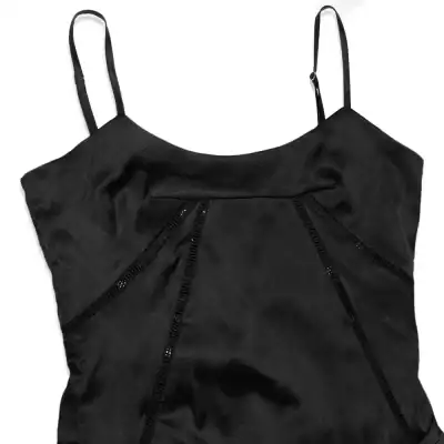 Elegant black dress with unique zipper accents, perfect for modern fashion & evening wear. Made from comfortable, high-quality material for a sleek look.