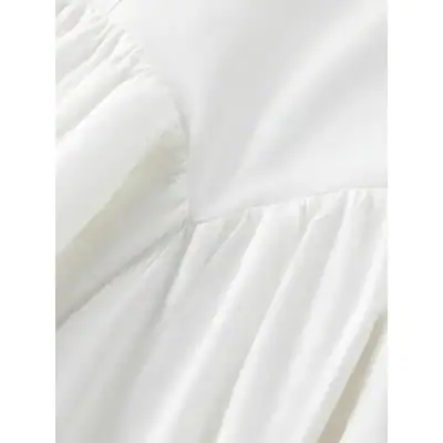 High-quality white bedding with elegant ruffles for a professional medical or spa setting. Soft, smooth, and comfortable, ideal for patient and client use.