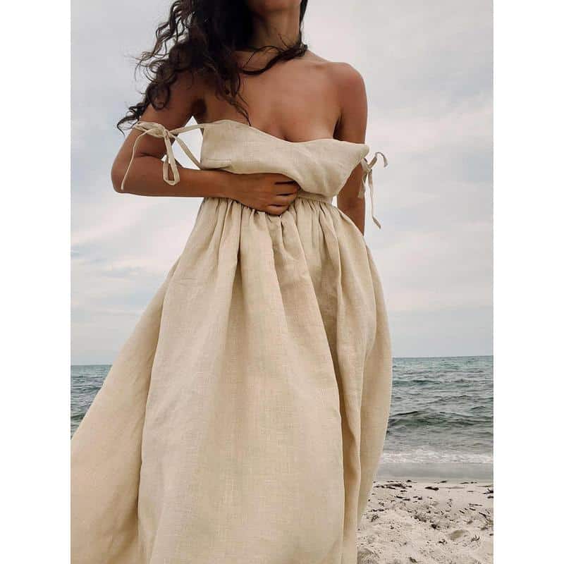 Elegant beach dress for women in natural linen fabric. Perfect for summer vacations, beach outings, or resort stays with comfortable fit and stylish design.